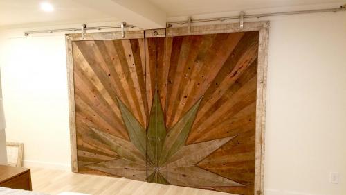 This is a custom art piece named Seneca Sunrise made from materials removed during the remodel